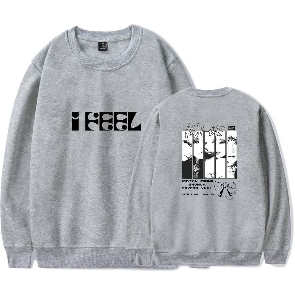 Unisex gray sweatshirt with bold "I FEEL" text on the front and a graphic design featuring faces and text on the back, made of affordable, high-quality material.