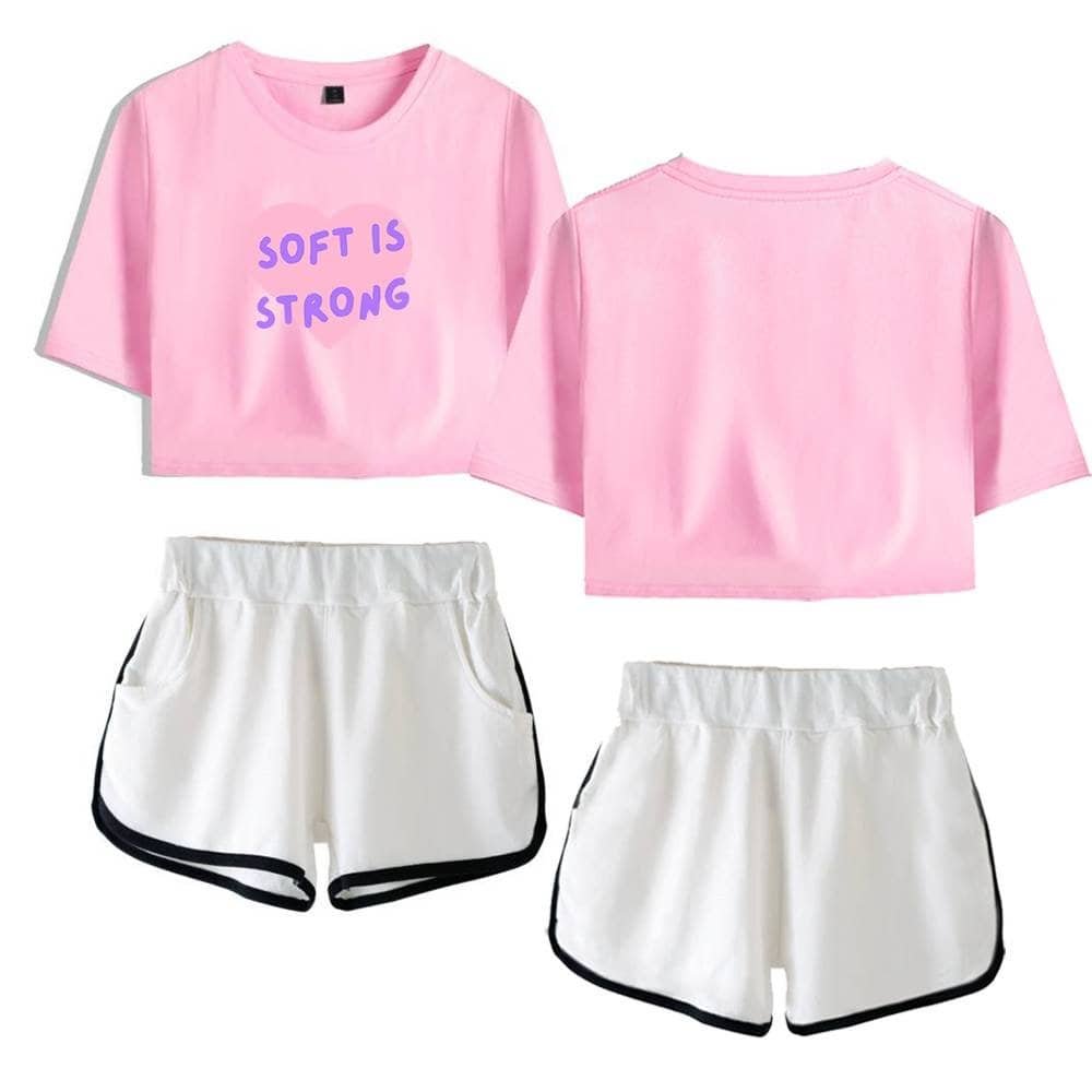 Soft pink cropped t-shirt with "Soft is Strong" text, casual comfortable summer wear.
