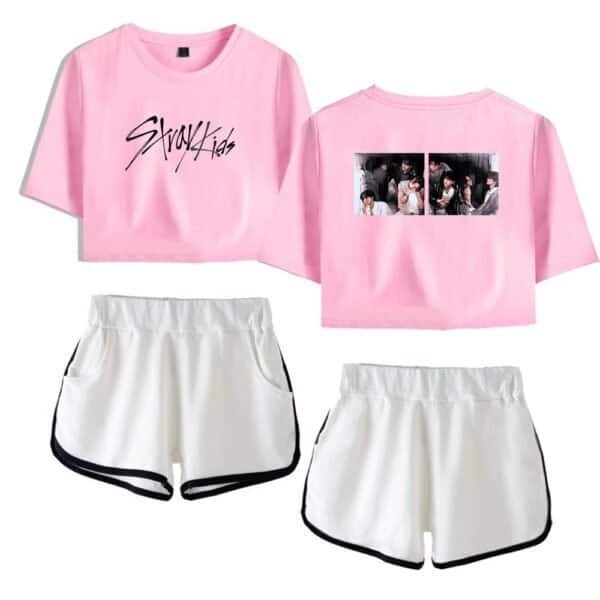 Graykid's pink cropped T-shirt with black text and a group photo on the back, paired with white athletic shorts with black trim. Stylish, affordable, and high-quality merchandise for fans.