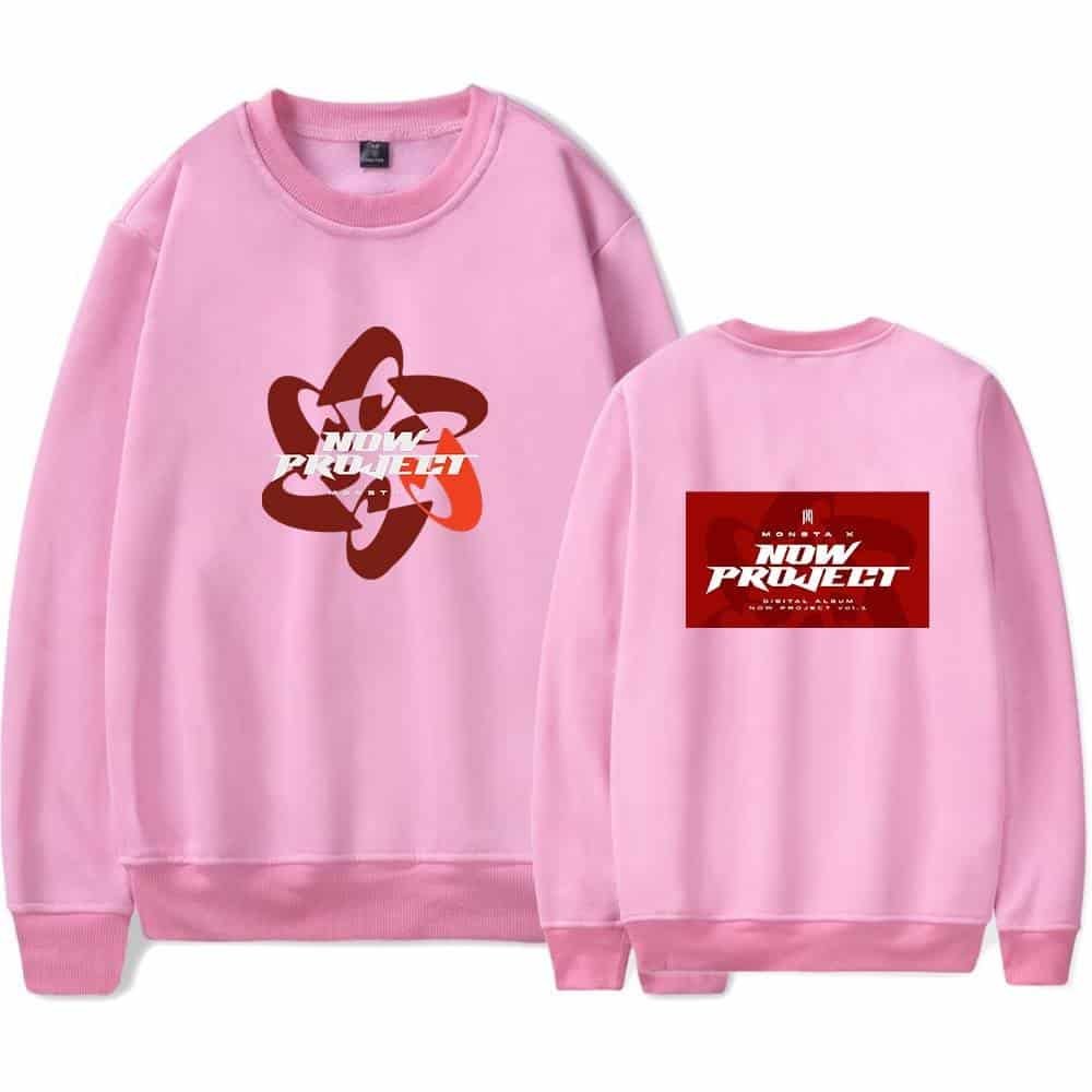 Adorable pink sweatshirt with "NOW PROJECT" logo and design, perfect for fans and casual wear.