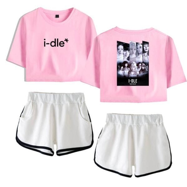 I-dle pink cropped T-shirt with black text and graphic design on the back, paired with white athletic shorts for casual high-quality merch.