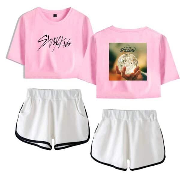 Soft pink cropped T-shirt with "Stray Kids" logo and a graphic of a crystal ball on the back, paired with white athletic shorts with black trim. Perfect for casual, stylish, and high-quality merch.