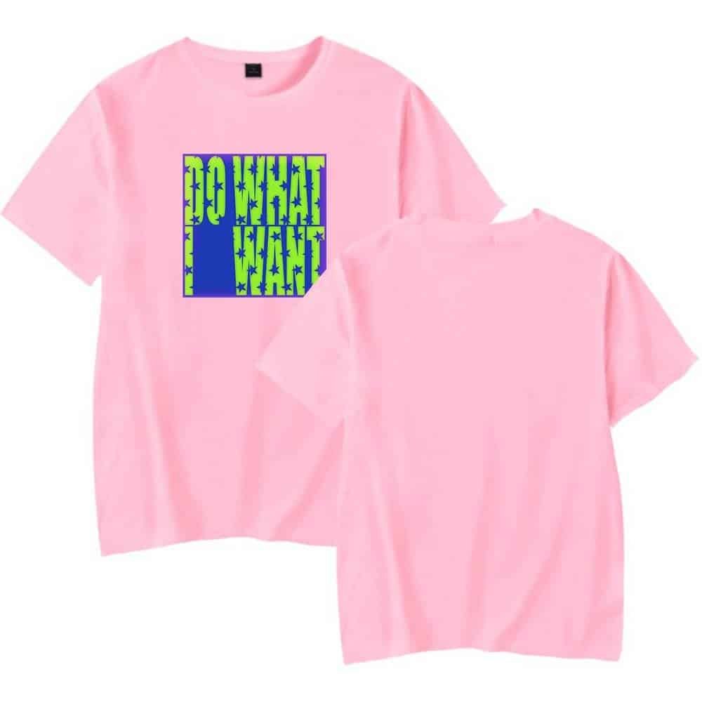 Pink graphic t-shirt with bold "DO WHAT I WANT" print in green and blue, casual streetwear style, high-quality, affordable, stylish merchandise for youth, perfect for everyday wear.