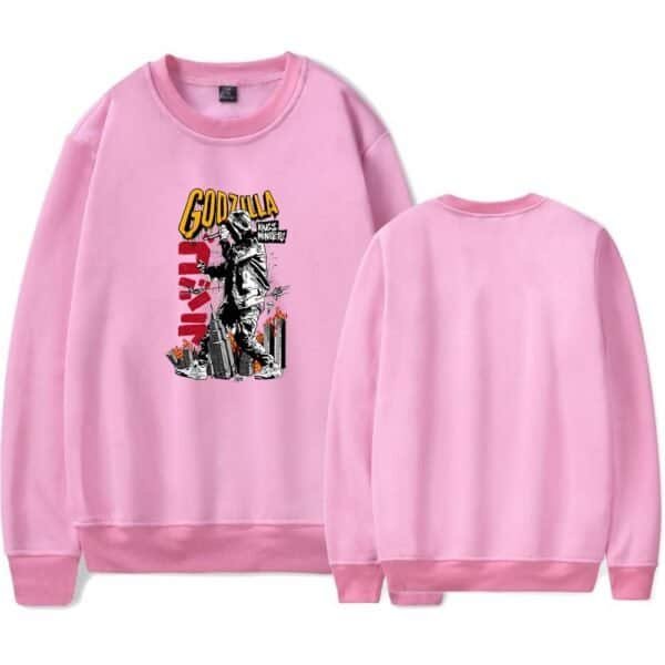 GODZILLA graphic sweatshirt with cityscape design, pink color, casual streetwear style. High-quality, affordable merchandise perfect for fans of horror movies and urban fashion.
