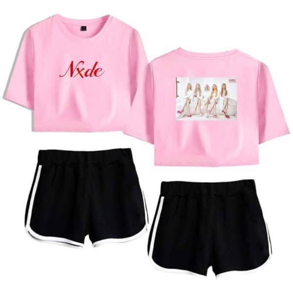 Nxde pink cropped t-shirt with graphic print and black athletic shorts with white trim, affordable high-quality merchandise for fans of K-pop and fashion.