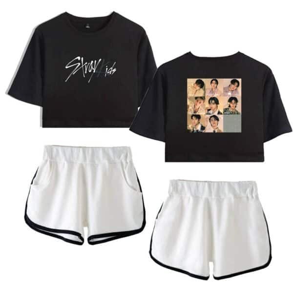 Black crop top with "Stray Kids" written in white, black crop top featuring a collage of photos of a K-pop group, white athletic shorts with black trim, trendy inexpensive high-quality merch set.
