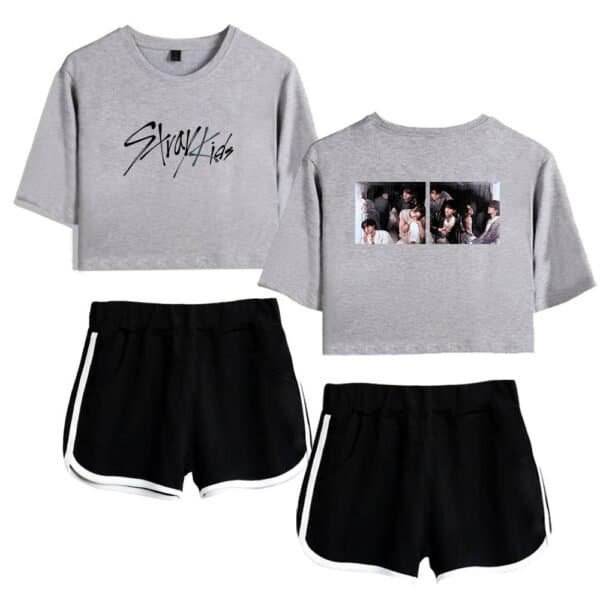 Gray cropped sweatshirt with "Stray Kids" text and group photo graphic, paired with black athletic shorts with white side stripes, affordable and high-quality trendy merch for fans or casual wear.