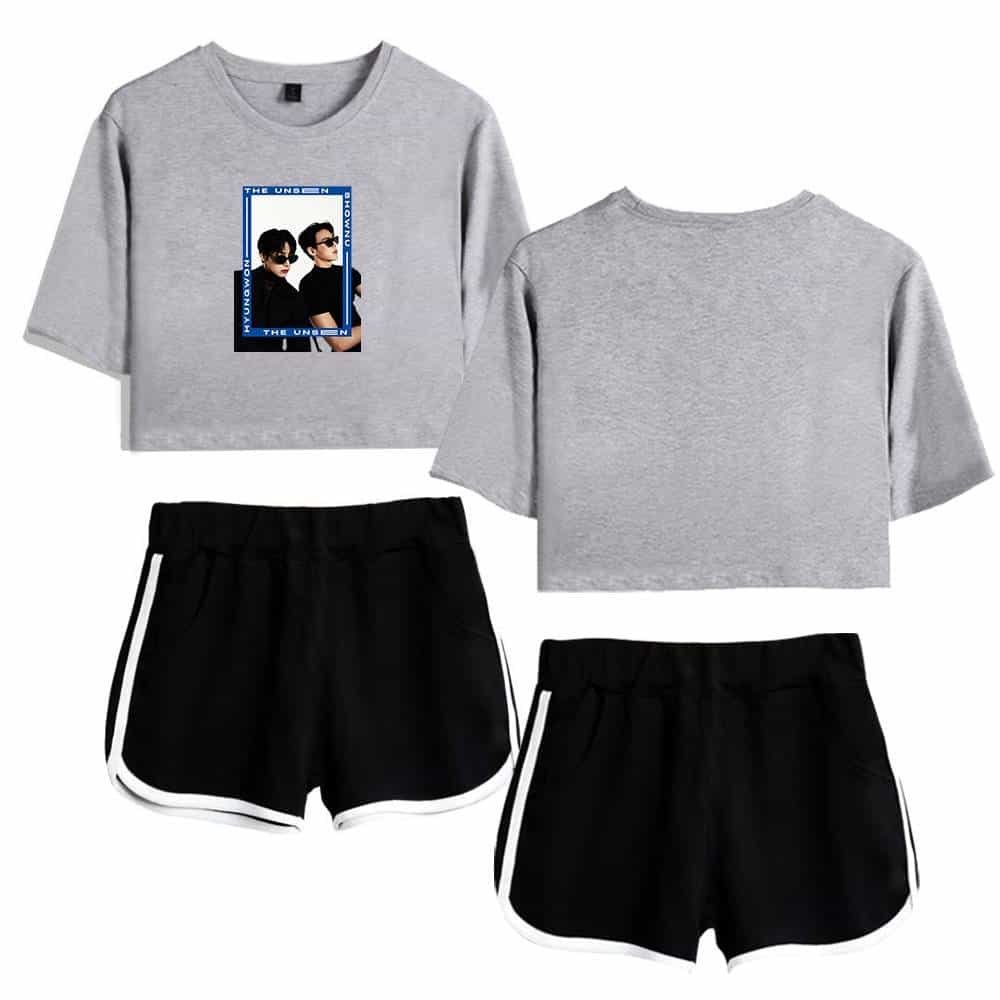 Grey cropped sweatshirt with graphic print and black athletic shorts with white trim, casual streetwear style, high-quality fabric, affordable prices, trendy and comfortable for everyday wear.