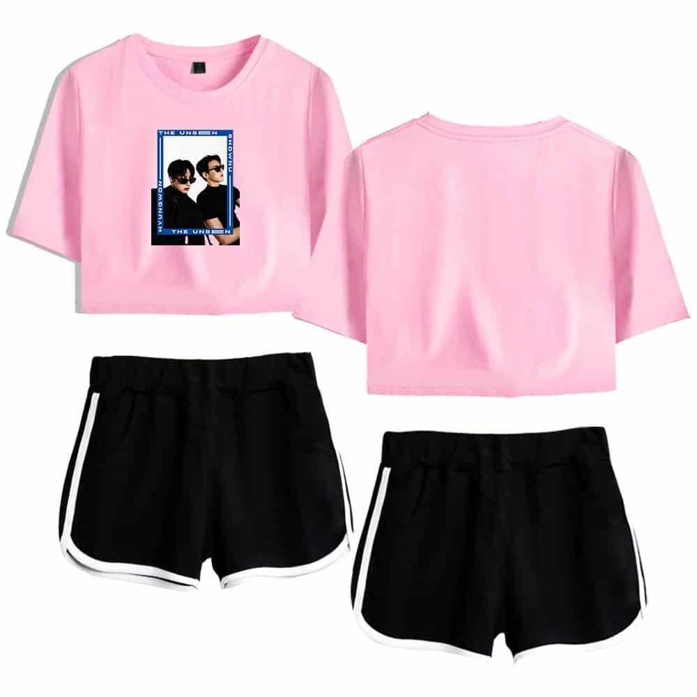 Pink graphic t-shirt with black shorts, casual summer outfit, affordable trendy clothing, high-quality merch for everyday wear, stylish and budget-friendly ensemble.