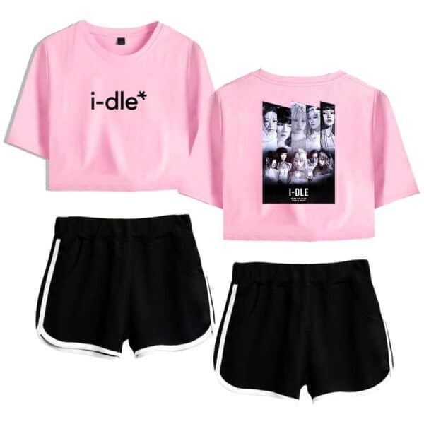 Cheap high quality merch pink cropped T-shirts featuring the "i-dle*" logo and member group photo, paired with black athletic shorts with white trim, perfect for casual or fan apparel.