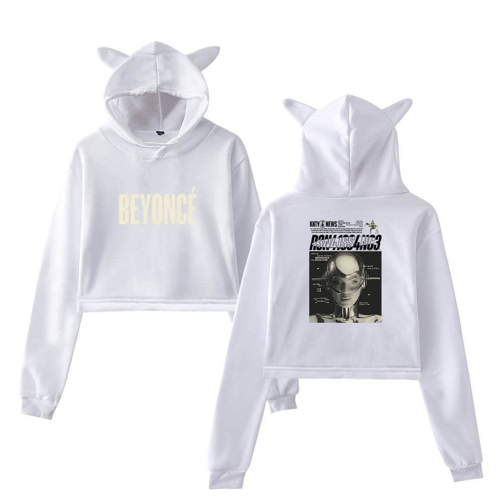 Plain white cropped hoodie with "BEYONCÉ" printed on the front and a stylish graphic on the back, featuring a futuristic theme with ears on the hood, perfect for affordable, high-quality streetwear.