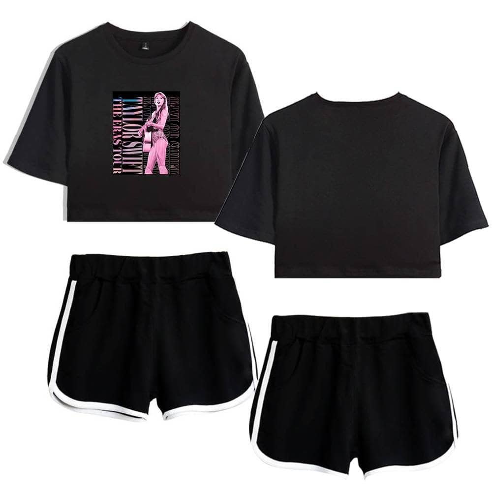 Black cropped t-shirt with pink graphic design and black athletic shorts with white trim.