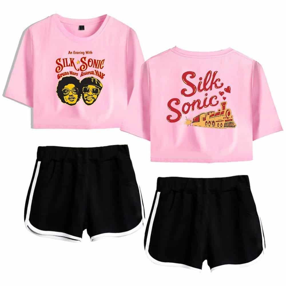 Silk sonic pink crop tops with graphic print and black athletic shorts with white trim, casual and trendy fashion, affordable and high-quality merchandise for fans, streetwear style.