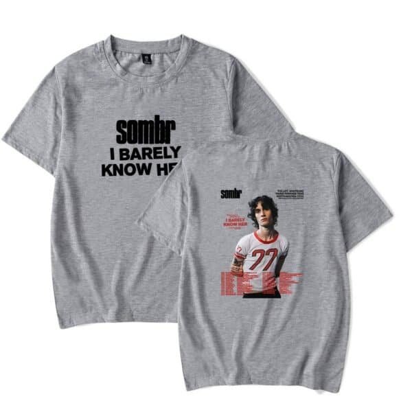 Sombra t-shirt with bold black text and a graphic of a young man in a sports jersey, casual fashion cheap high quality merch.