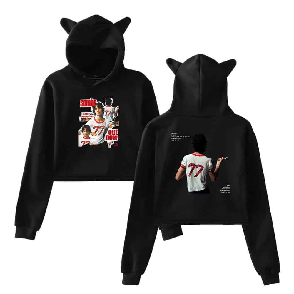 Black hoodies with unique graphic designs of a woman in a sports jersey, featuring bold text and artistic elements, perfect for stylish casual wear.