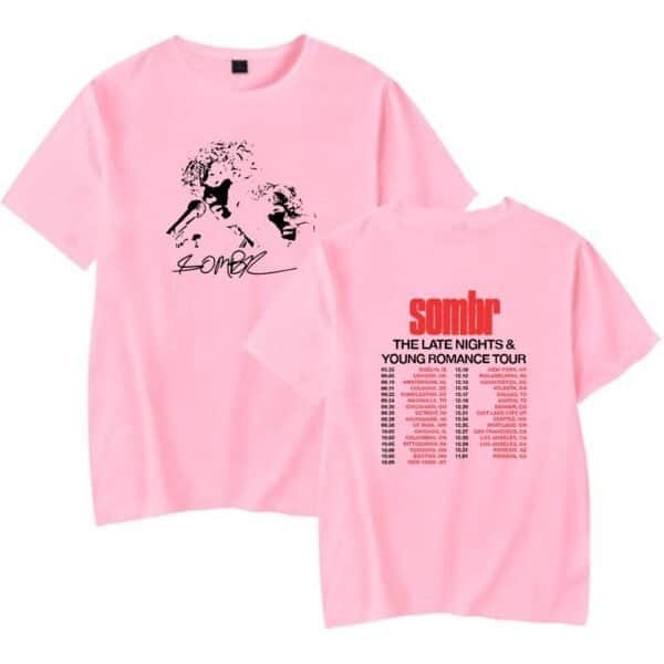 Comfortable pink graphic T-shirt with bold black and red print, ideal for affordable, high-quality merchandise. Perfect for casual wear or tour merch collections.