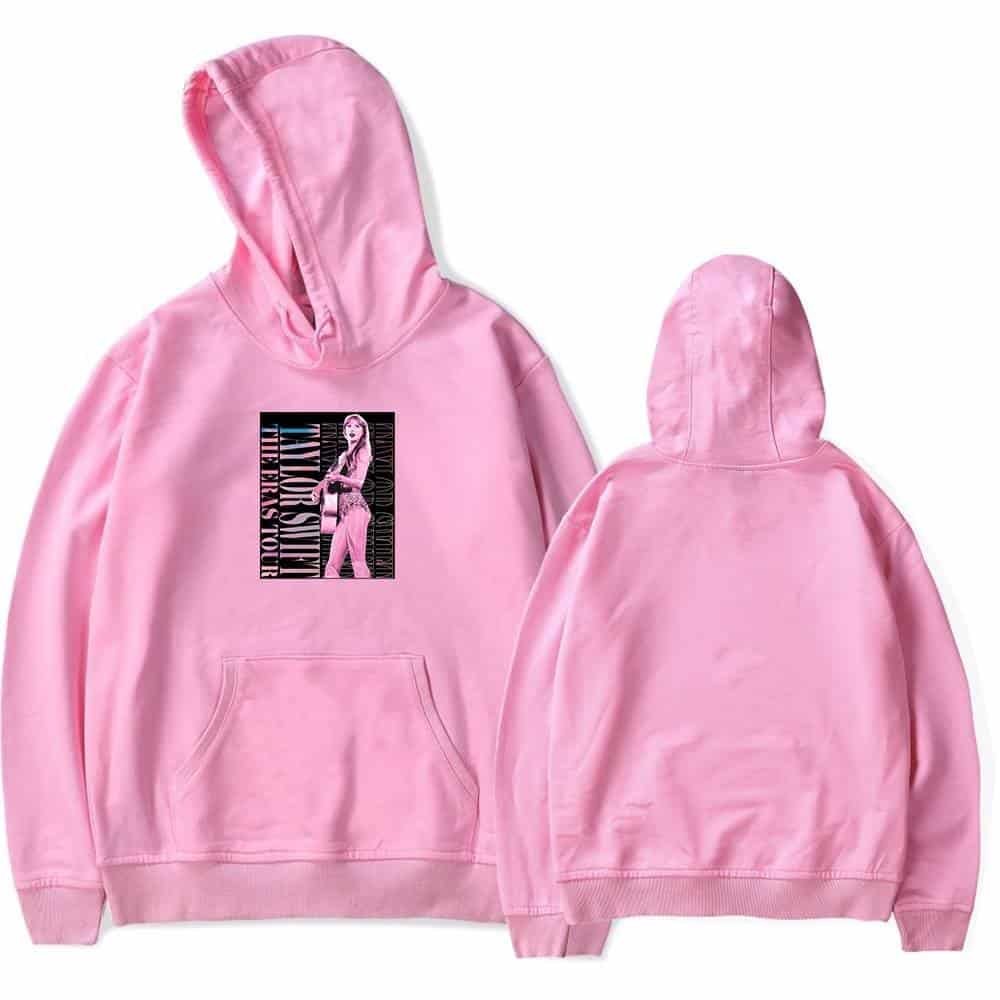 Pink hoodie with a graphic print of a woman and text, stylish and affordable high-quality merchandise for casual wear and fashion enthusiasts.