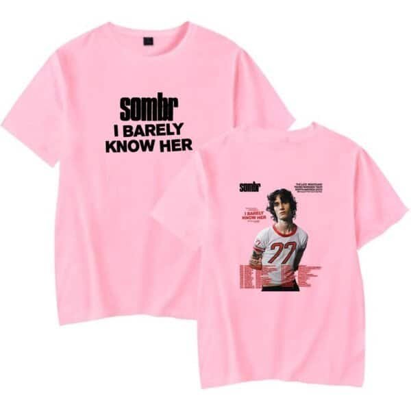 Sober pink t-shirt with bold black text and sports-themed graphic, trendy streetwear, affordable high-quality merchandise for casual wear, unisex design for fans of music and sports.