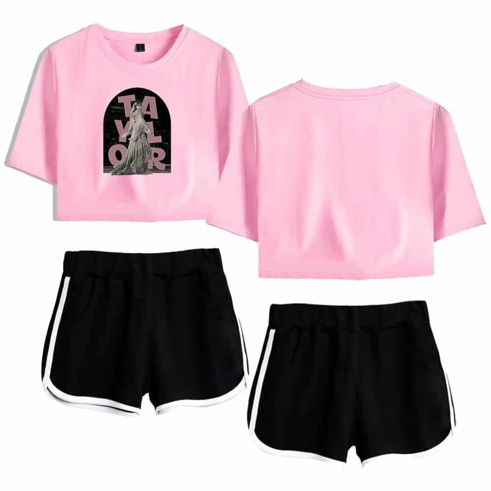 Comfortable pink graphic cropped T-shirt with black and white athletic shorts, trendy casual streetwear set for women.
