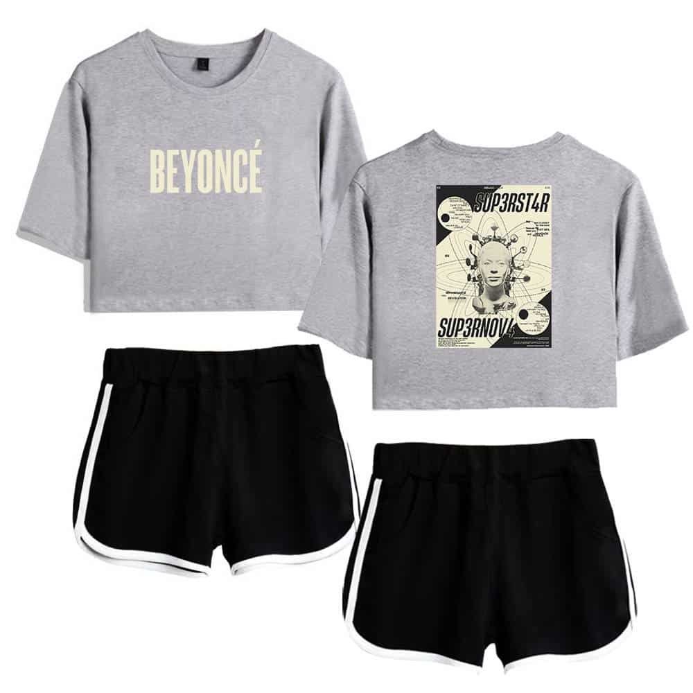 Beyoncé sweatshirt and graphic print crop top, casual black athletic shorts with white stripes.
